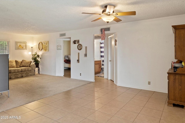 4333 E Desert Cactus St, Phoenix, AZ 85032 - living area with a ceiling fan, a textured ceiling, light tile patterned flooring, and light colored carpet