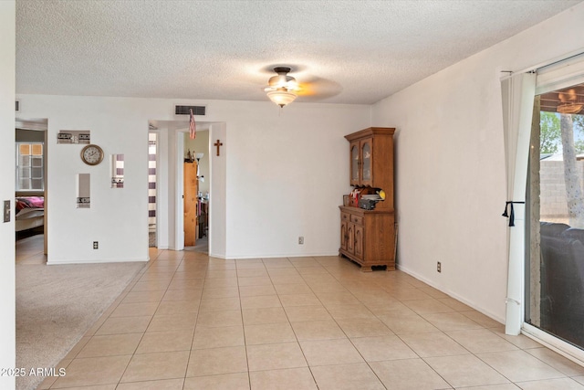 4333 E Desert Cactus St, Phoenix, AZ 85032 - empty room with a textured ceiling, ceiling fan, light tile patterned flooring, and baseboards