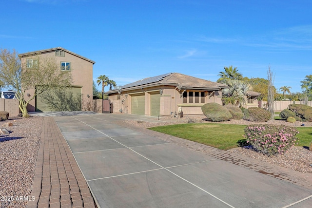 exterior space featuring a garage and solar panels