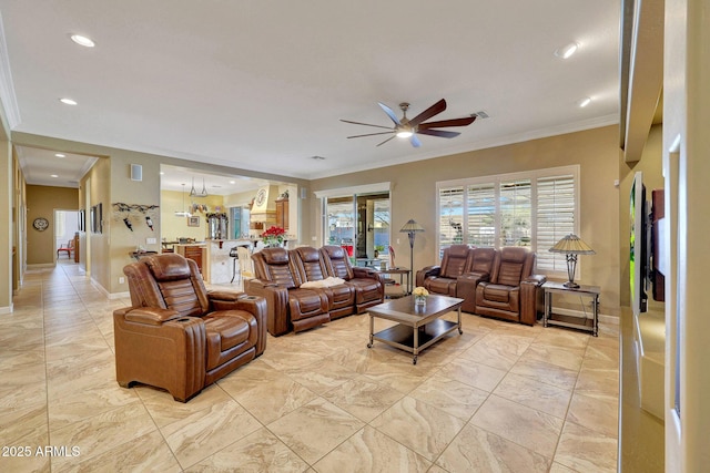 living room with ceiling fan and crown molding