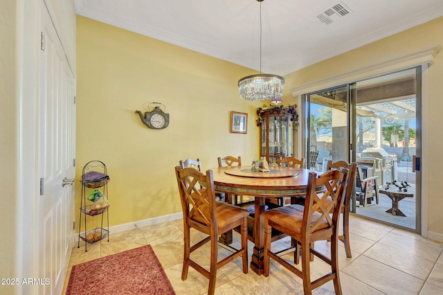 dining area featuring crown molding and light tile patterned floors