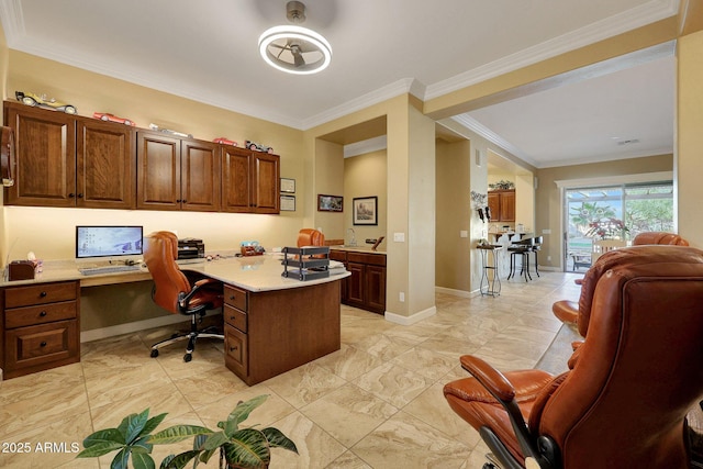 office area with crown molding and built in desk