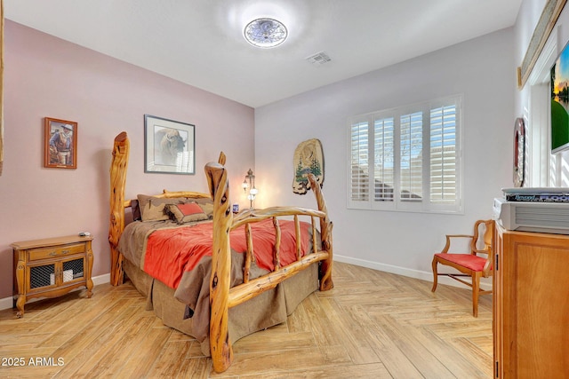 bedroom featuring light parquet floors