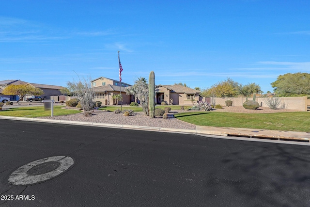 ranch-style home featuring a front yard