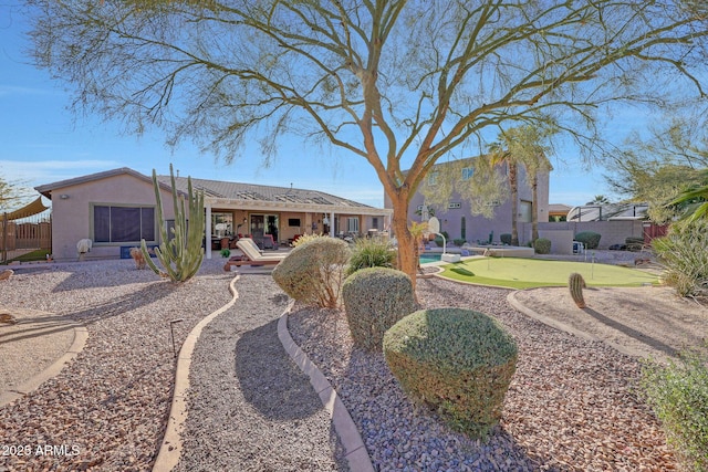 back of property featuring a patio