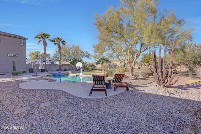 view of yard with a fenced in pool and a patio