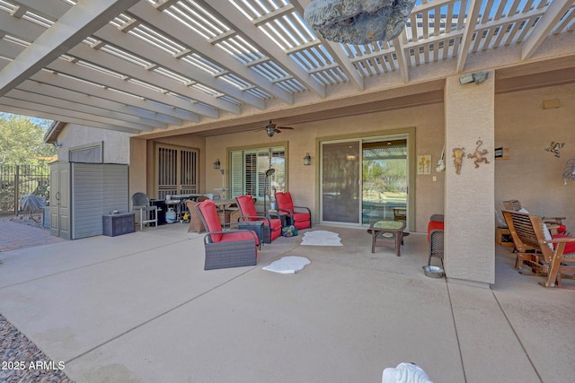 view of patio with ceiling fan and a pergola