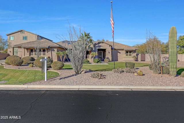 ranch-style home with a front lawn