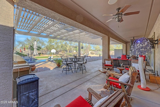 view of patio featuring ceiling fan, a pool, an outdoor living space, and a pergola