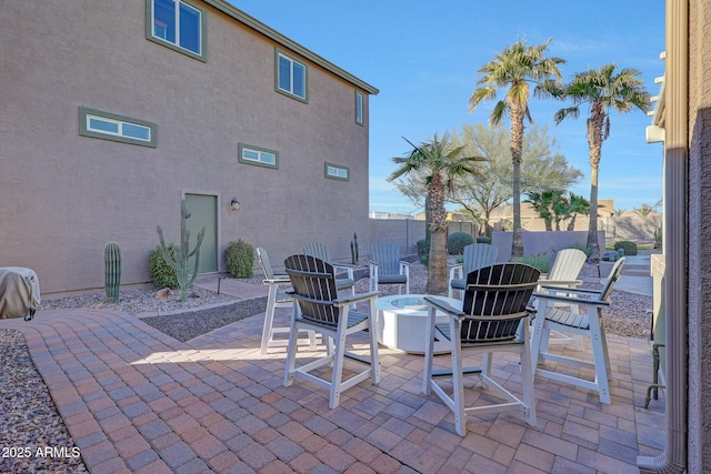 view of patio featuring an outdoor fire pit