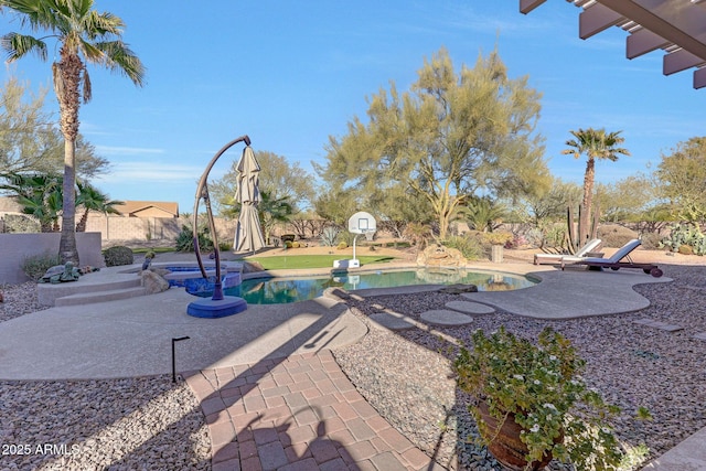 view of patio featuring a swimming pool with hot tub