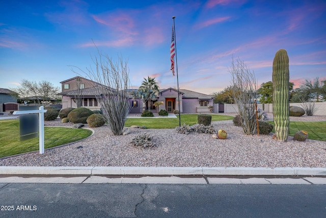 ranch-style house featuring a lawn