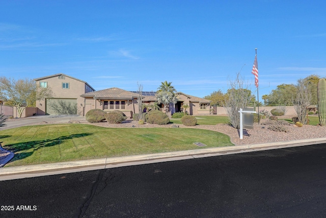 view of front facade with a front yard and a garage