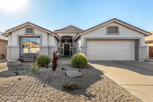 ranch-style home featuring a garage