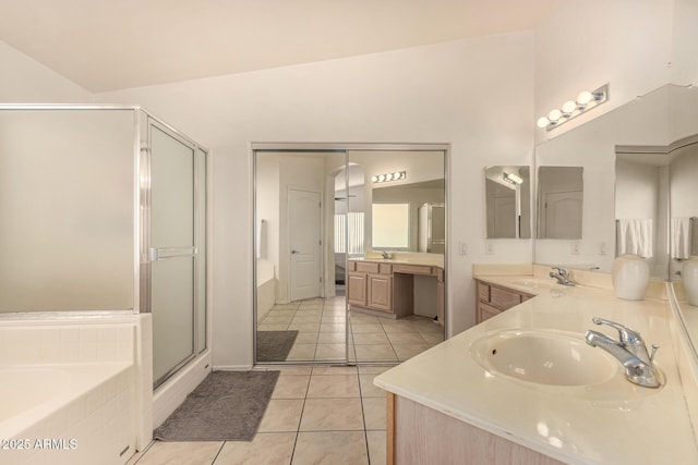 bathroom featuring vaulted ceiling, vanity, separate shower and tub, and tile patterned flooring