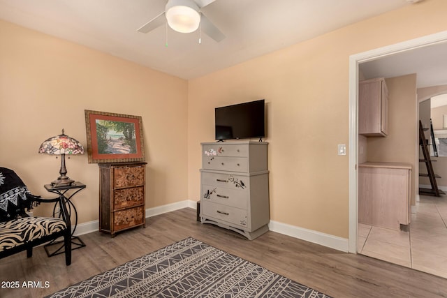 sitting room featuring hardwood / wood-style flooring and ceiling fan