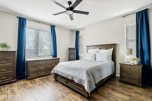 bedroom with dark wood finished floors and a ceiling fan