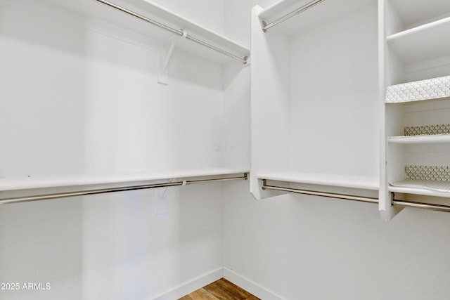 spacious closet with wood finished floors