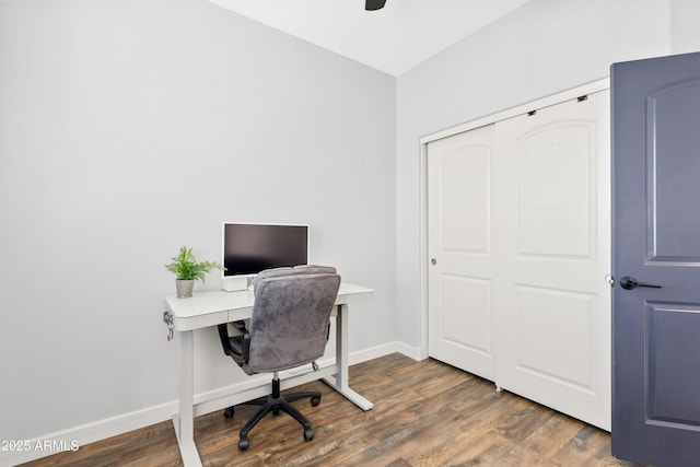 office space with wood finished floors, baseboards, and ceiling fan