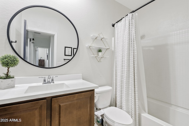 bathroom featuring toilet, vanity, and shower / tub combo