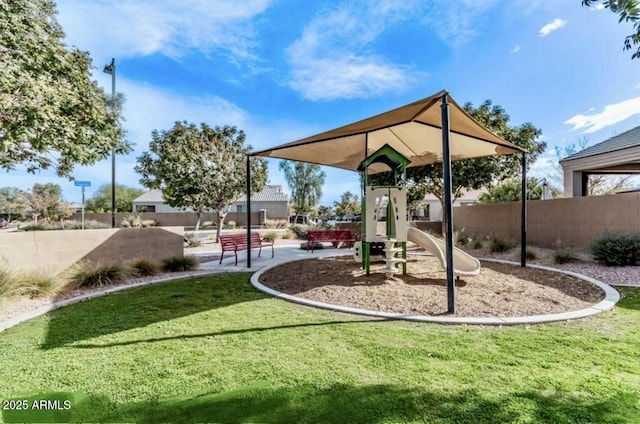 community playground with a lawn and fence