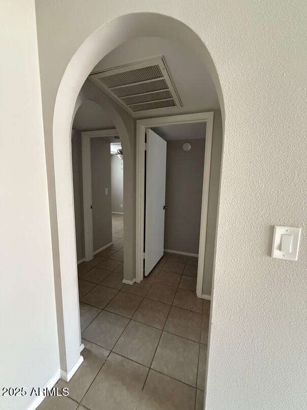 hallway featuring light tile patterned flooring