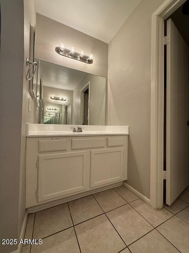 bathroom with vanity and tile patterned floors