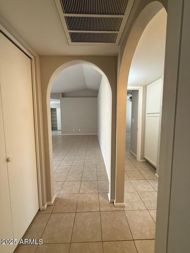 corridor with light tile patterned floors