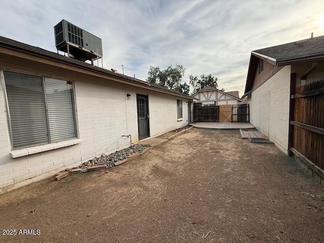 view of yard with cooling unit and a patio area