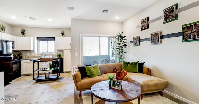 living room featuring light tile patterned floors