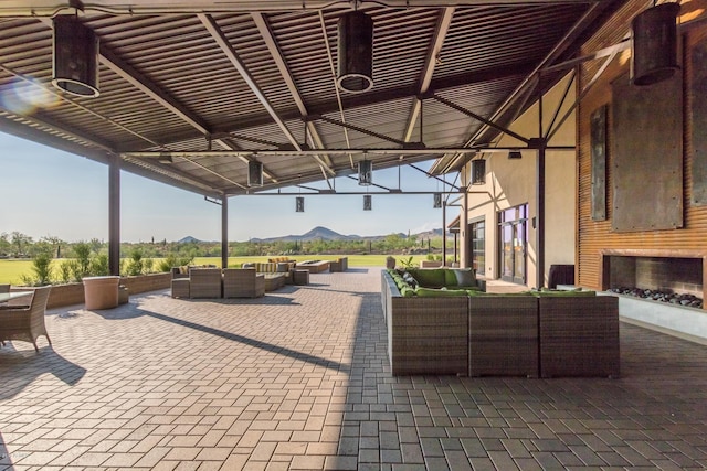 view of patio / terrace with a mountain view and outdoor lounge area