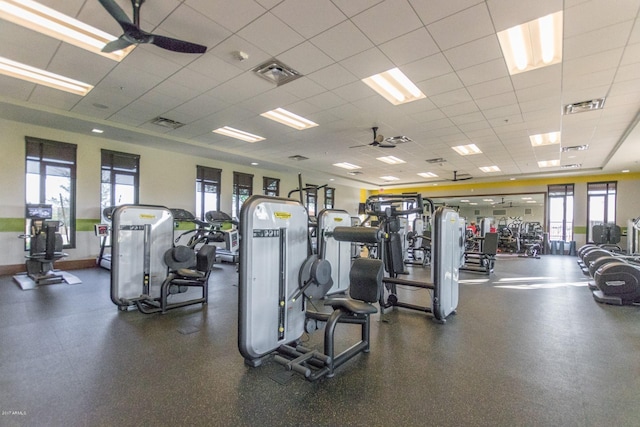 workout area featuring a drop ceiling and ceiling fan