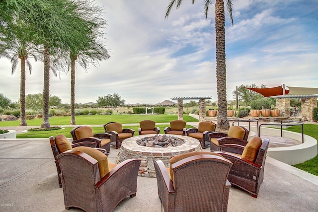 view of patio with a fire pit