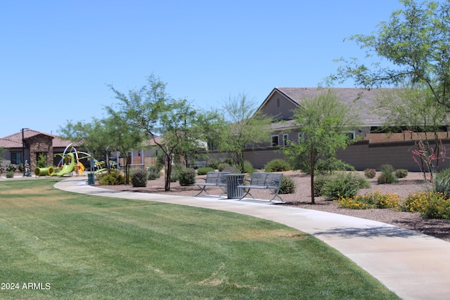 view of home's community with a yard