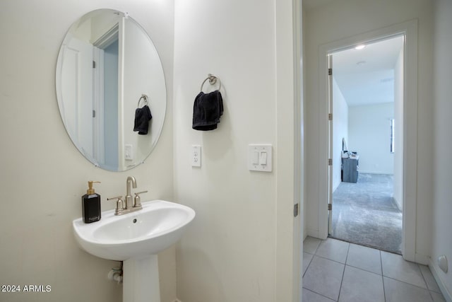 bathroom with tile patterned flooring and sink