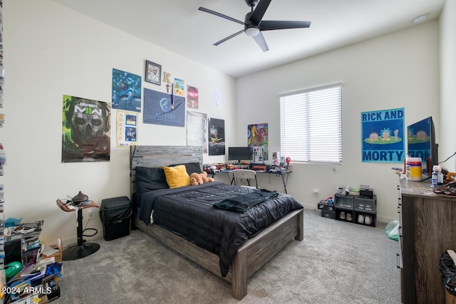 bedroom with ceiling fan and light carpet