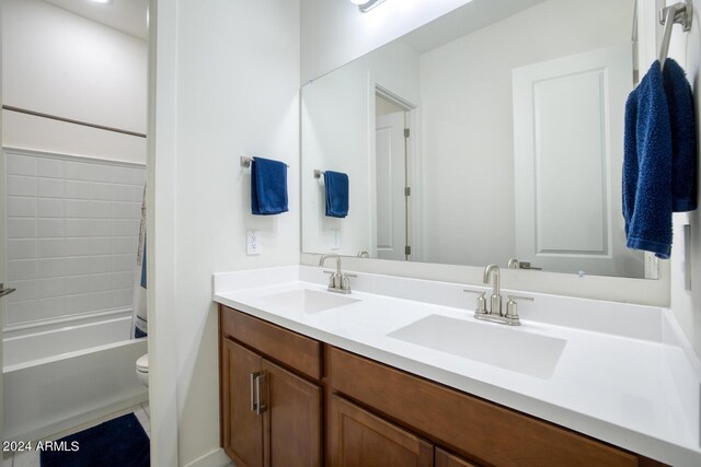 full bathroom with vanity,  shower combination, and toilet