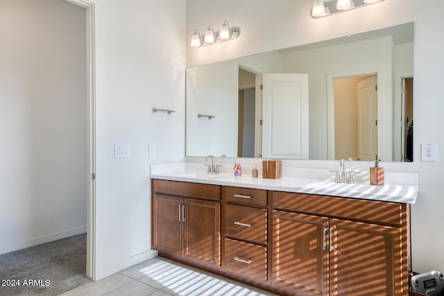 bathroom with tile patterned flooring and vanity