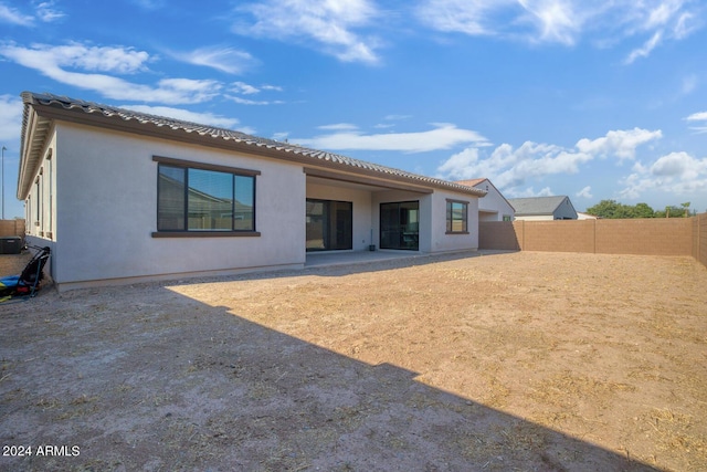 rear view of house featuring a patio and central AC unit