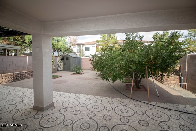 view of patio featuring a shed