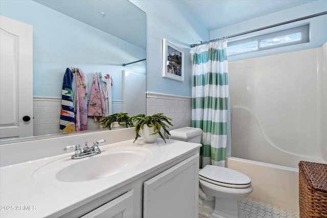 10239 E Salt Bush Dr, Scottsdale, AZ 85255 - bathroom featuring tile walls, shower / bath combo, vanity, and toilet