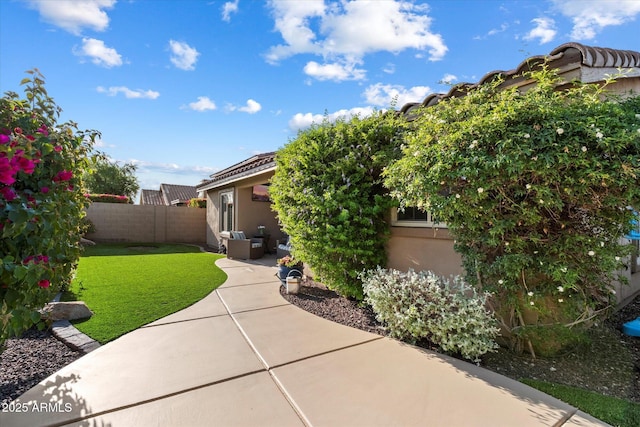 10239 E Salt Bush Dr, Scottsdale, AZ 85255 - view of property exterior with fence, an outdoor hangout area, stucco siding, a patio, and a yard