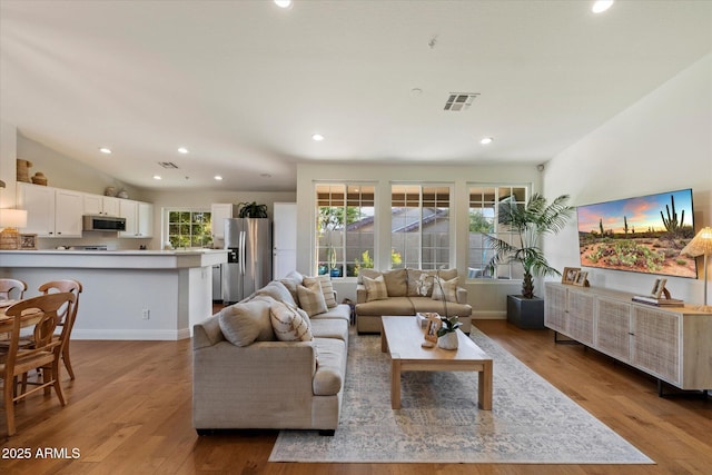 10239 E Salt Bush Dr, Scottsdale, AZ 85255 - living room with recessed lighting, baseboards, visible vents, and wood finished floors