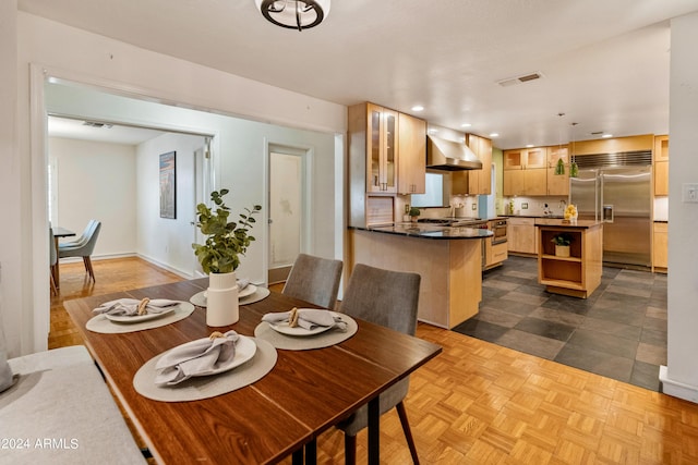 dining space with dark parquet floors