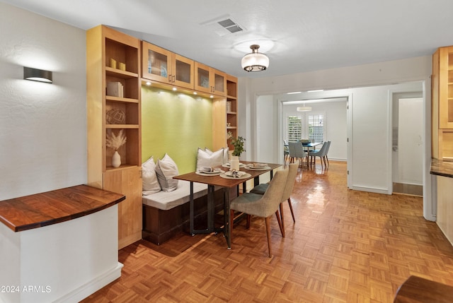 dining room with light parquet floors