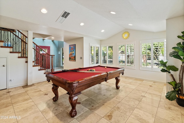 game room featuring light tile patterned floors, vaulted ceiling, and billiards