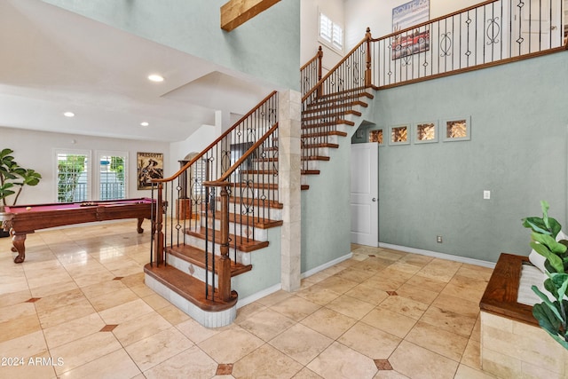 stairs featuring tile patterned flooring and billiards