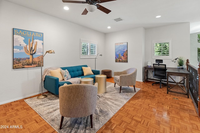 interior space featuring a wealth of natural light, light parquet flooring, and ceiling fan