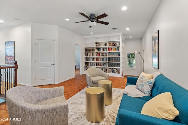 living room featuring ceiling fan and light parquet flooring