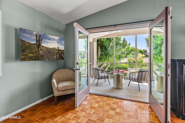 sitting room with french doors, light parquet flooring, and plenty of natural light